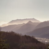 Saint Helens and the North Fork Toutle River in a moody light on the approach to the trailhead as seen from Hwy 504.