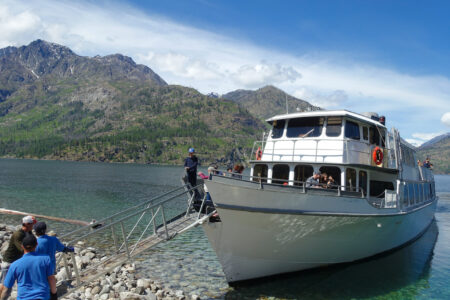 Disembarking at Prince Creek "Backpackers stepping off the Lady of the Lake ferry at Prince Creek to begin the Lakeshore Trail on Lake Chelan"